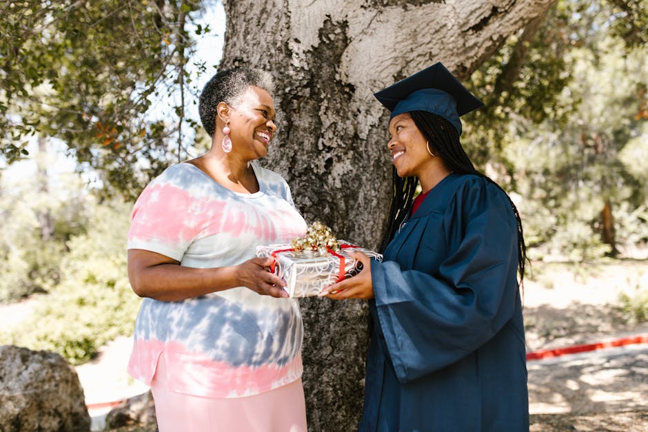 A Woman Giving a Graduation Gift to her Daughter