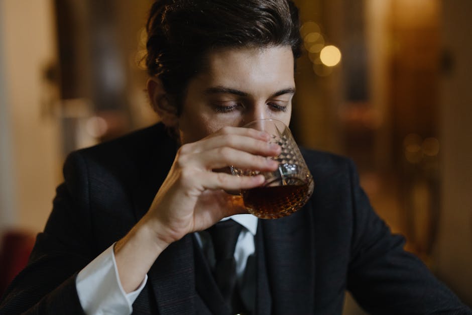 Photo of a Man Drinking Whiskey