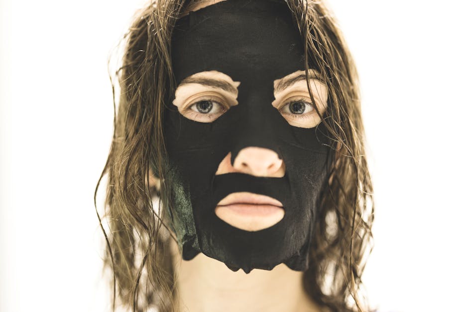 Close-Up Shot of a Woman with Black Face Mask