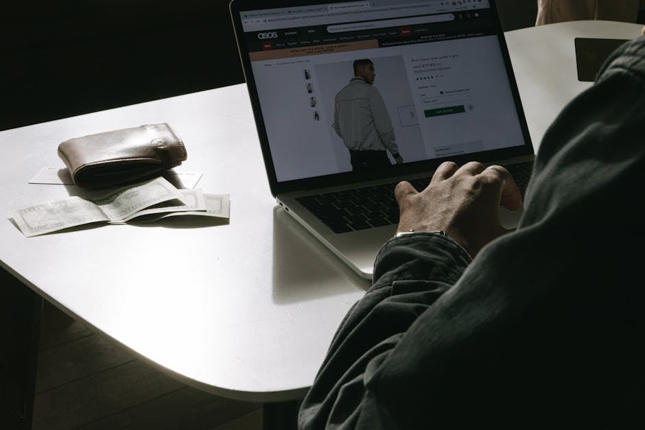 Man Shopping Online on Laptop