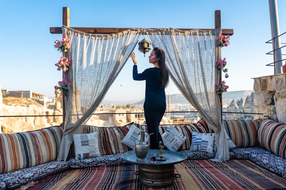 Woman in Traditional Outdoor Cafe with Pillows