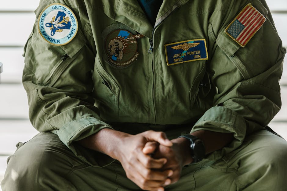 Close-Up Photo of Man Wearing Military Uniform with Badges