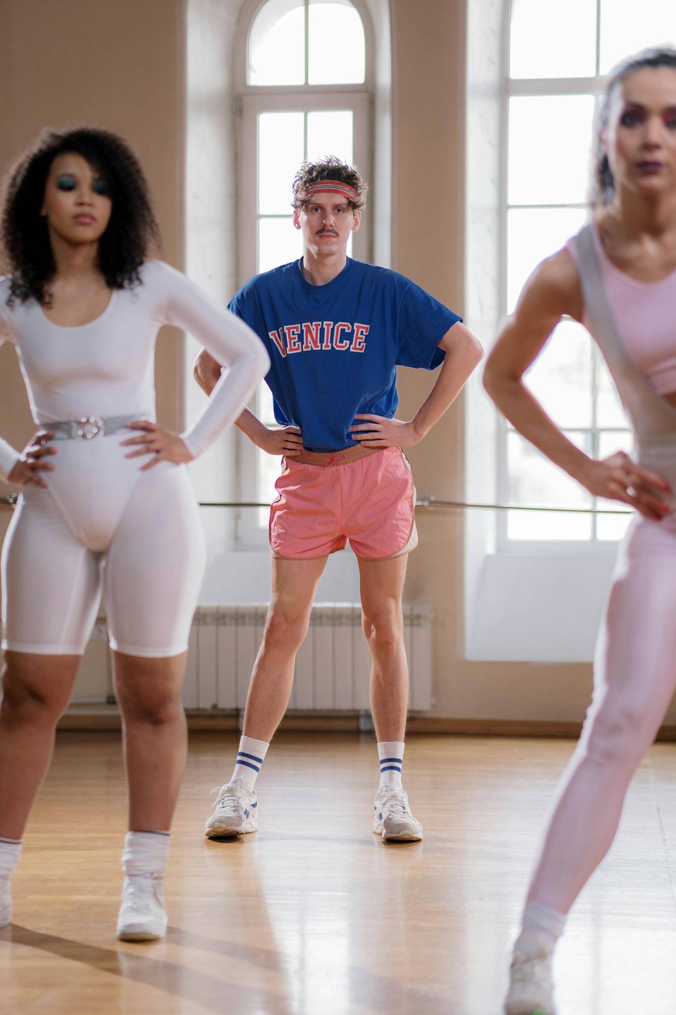 Man and Woman Looking at Fitness Instructor