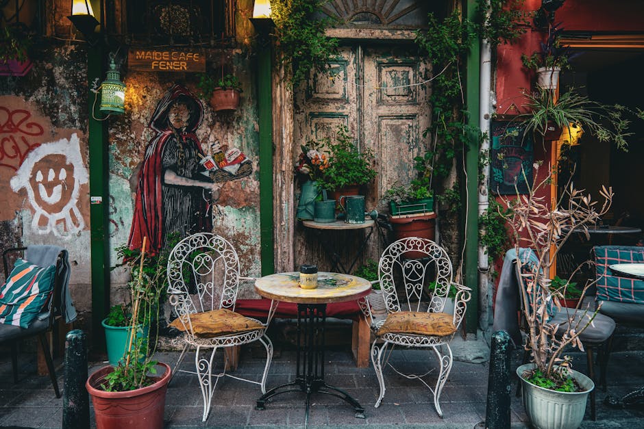 A patio with chairs and tables outside of a building