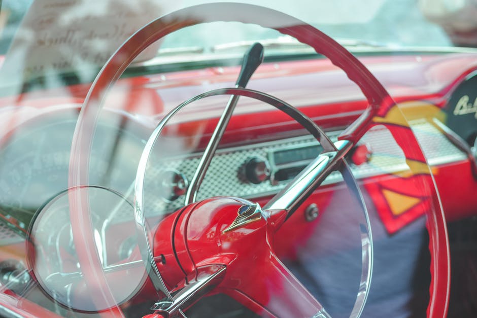 A red and white car with a steering wheel