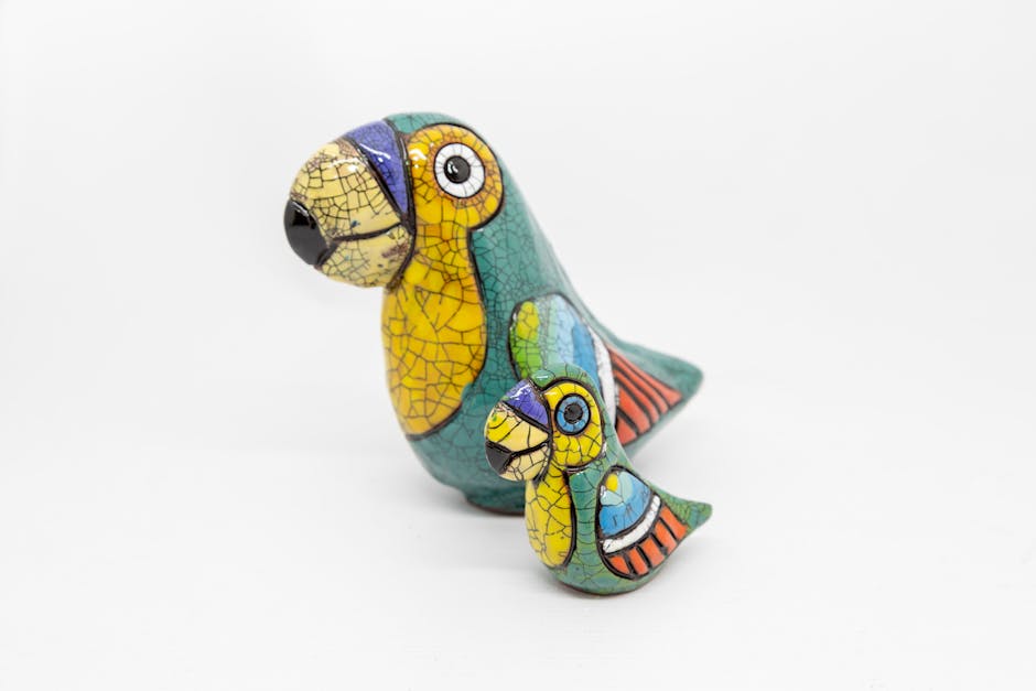 Colorful Ceramic Bird Figurines on White Background
