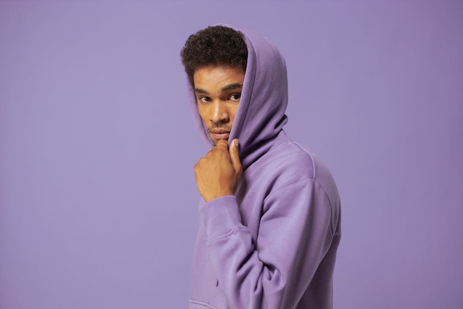 Man in Purple Hoodie Looking at the Camera