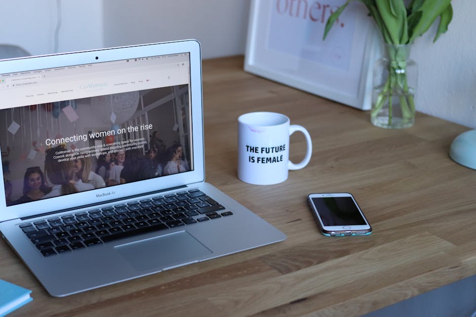 Modern opened laptop and smartphone on desk