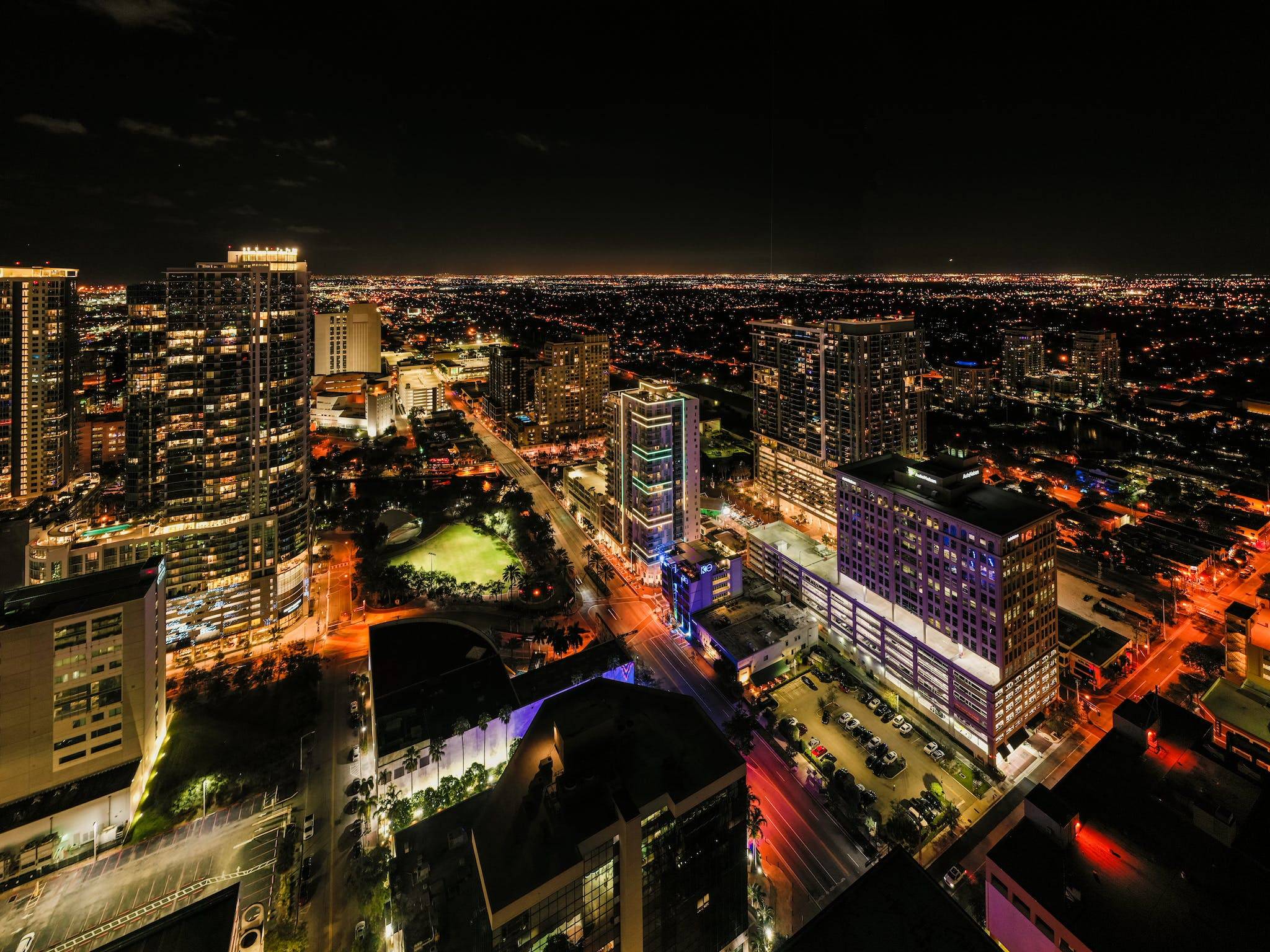 Illuminated megapolis with multistory buildings and skyscrapers at night