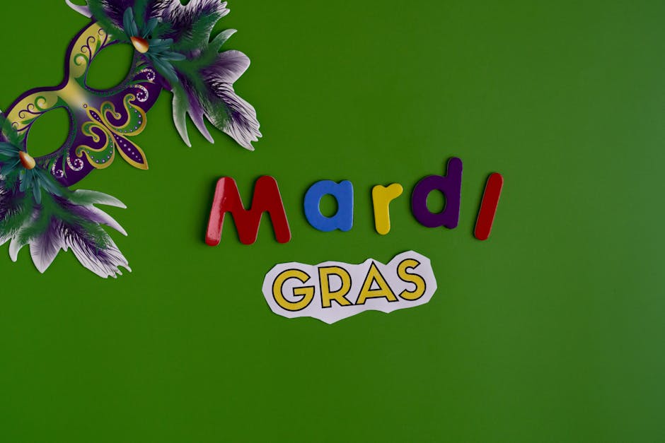 Mardi Gras Text And Mask On Green Background