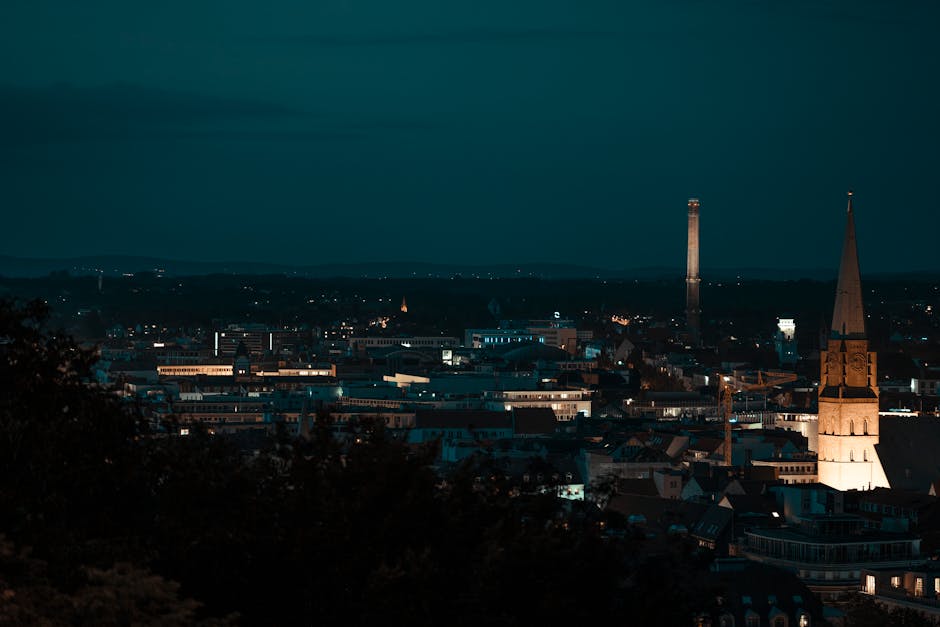 Old residential buildings located in historic district with shining lights at dark night