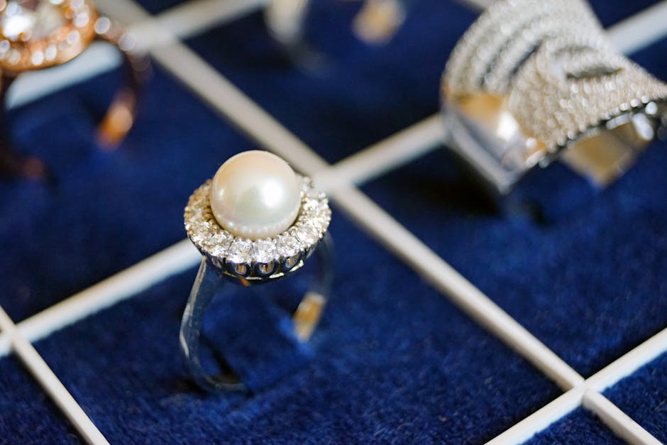 White Pearl Ring on Blue Surface