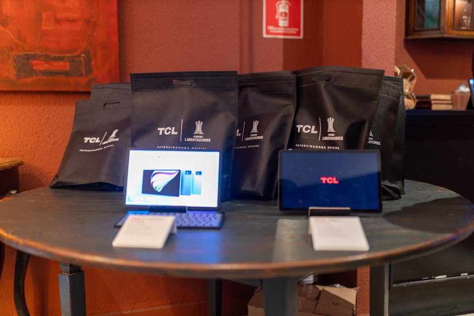 TCL Promotional Setup with Display Tablets and Gift Bags