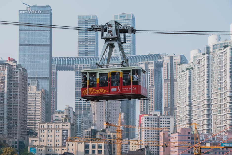 A cable car is in the middle of a city