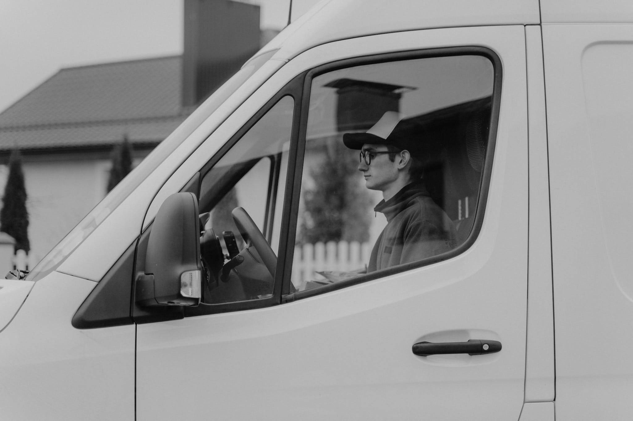 Man Driving a Delivery Van