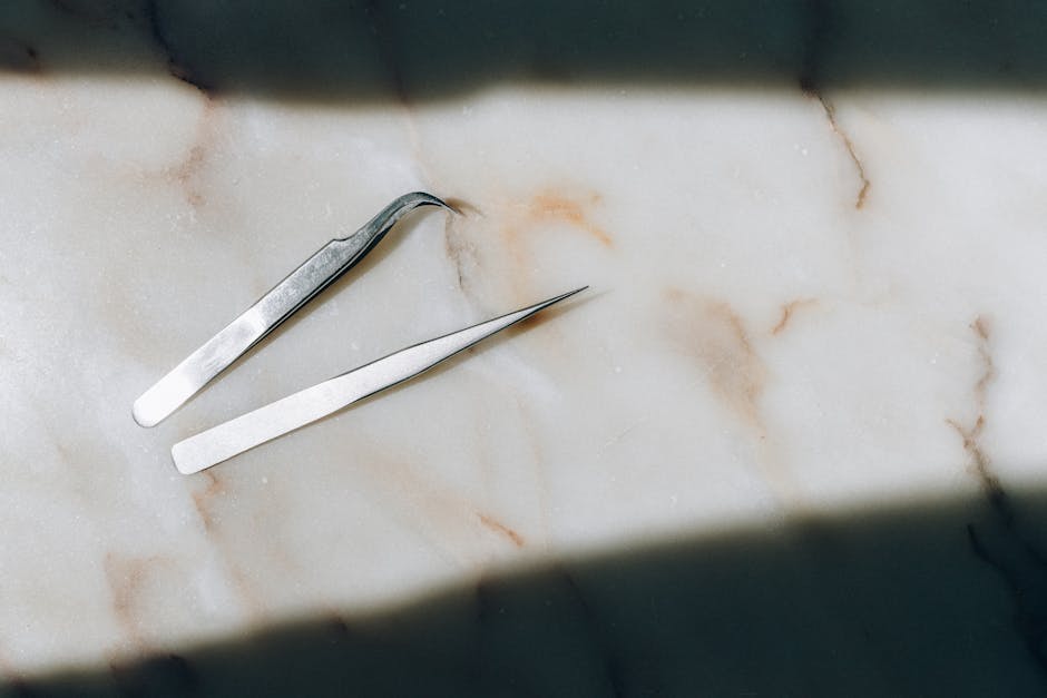 Stainless Steel Bread Knife on White Textile