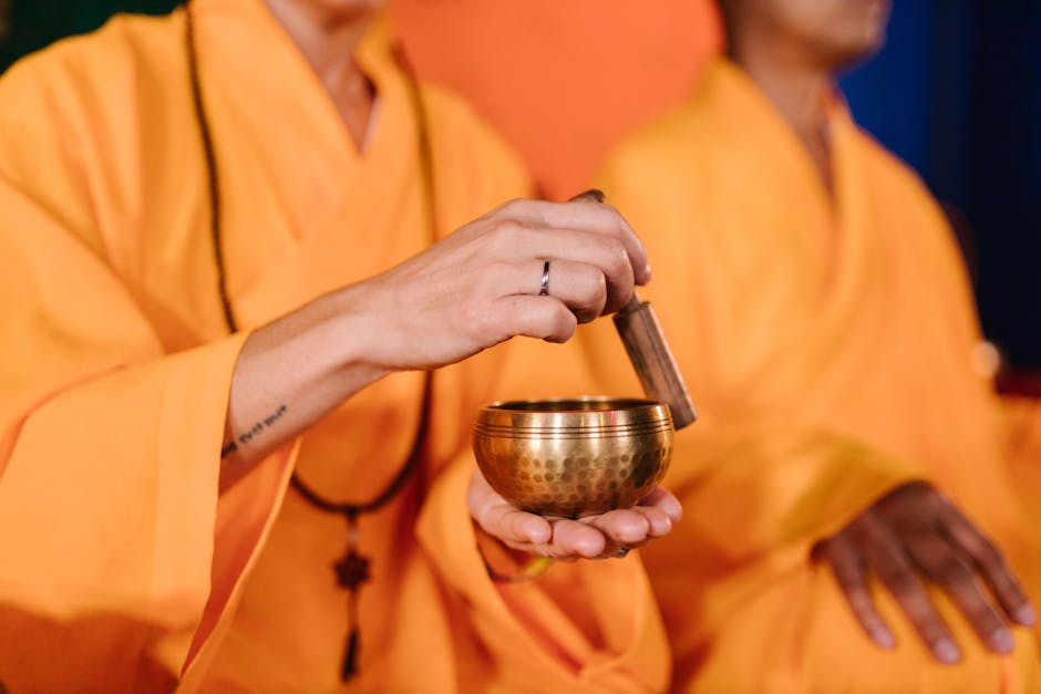 Person Holding Stainless Steel Cup