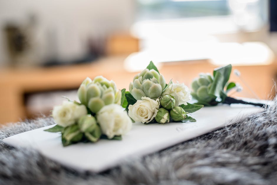 Small wedding buttonholes bouquets on fluffy surface