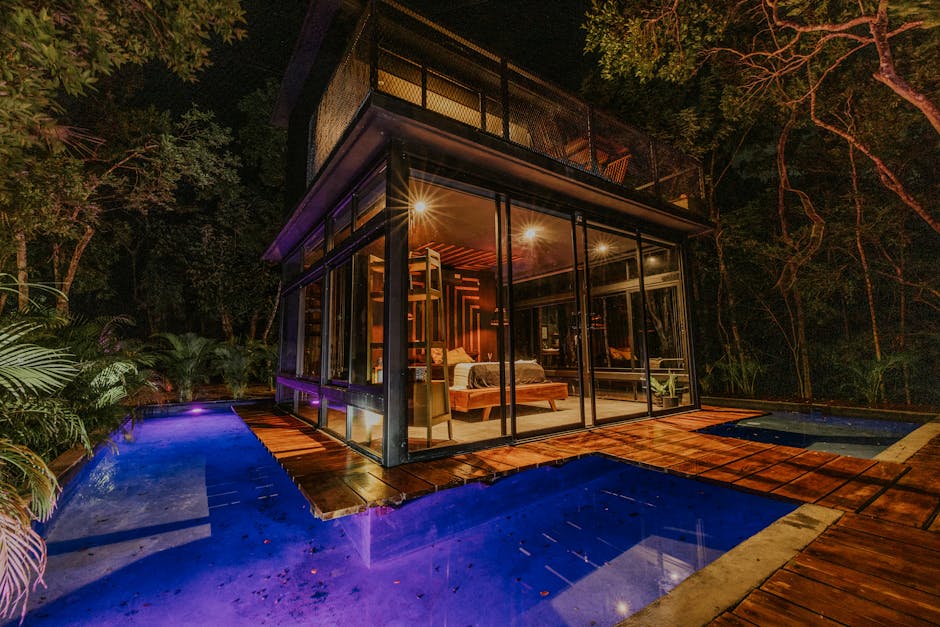 A house with a pool at night