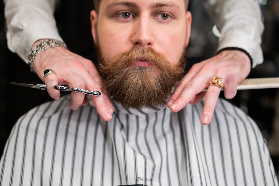 Man in White and Gray Pinstripe Having a Haircut