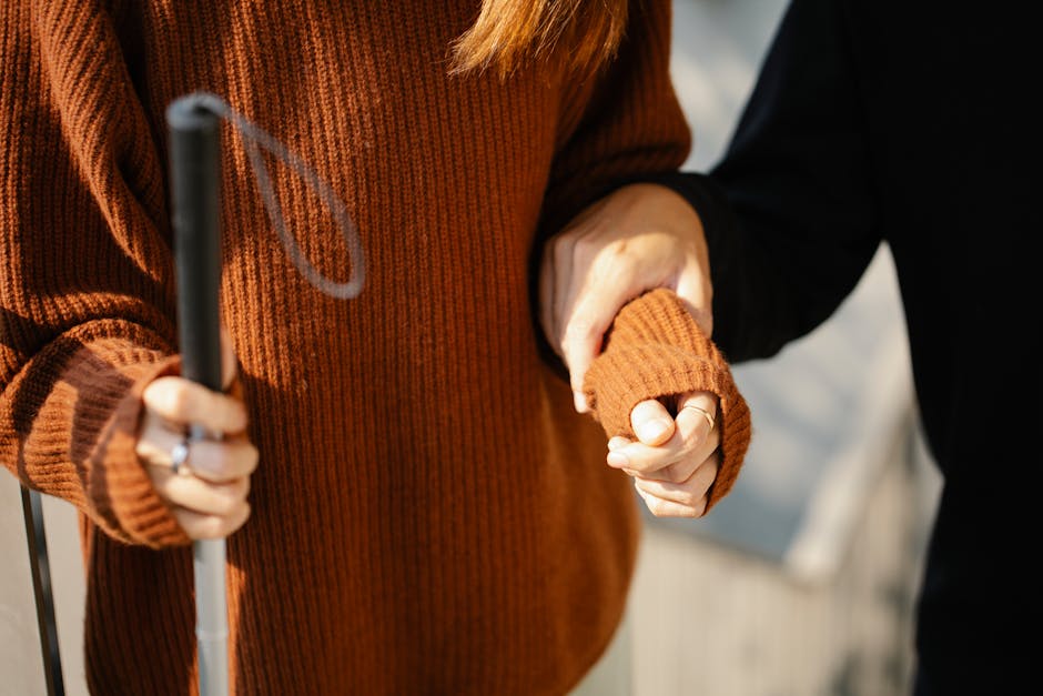 Photo of Man Holding on Woman’s Arm