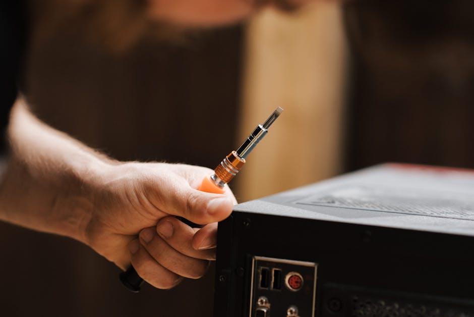 Faceless man checking connector in studio