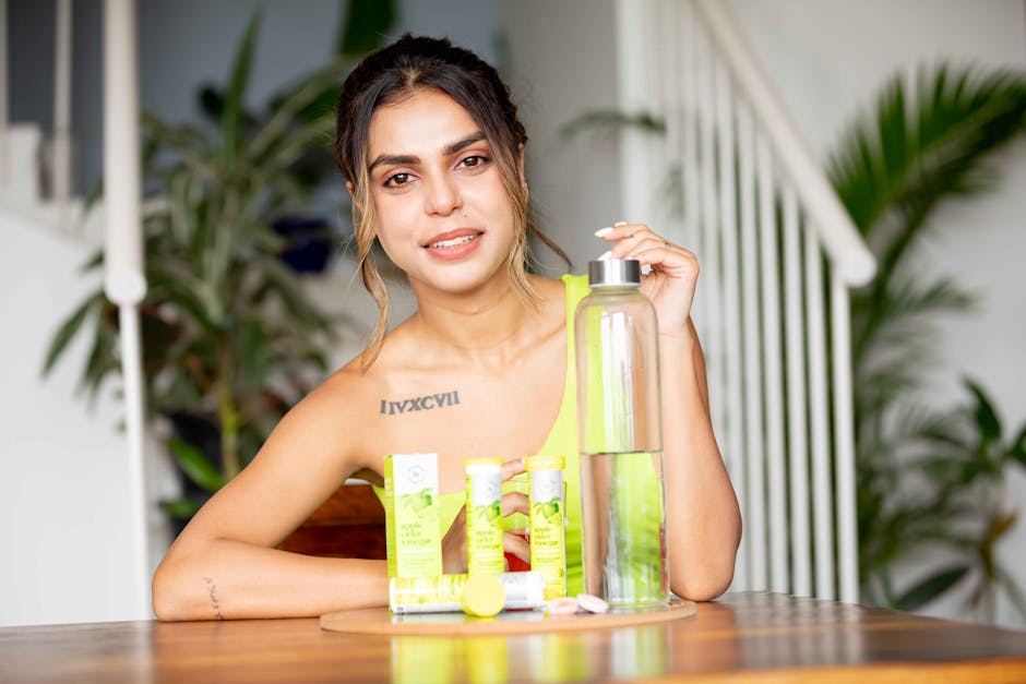 Woman Sitting at a Table with Fat Loss Supplements Wellbeing Nutrition Apple Cider Vinegar and a Bottle of Water