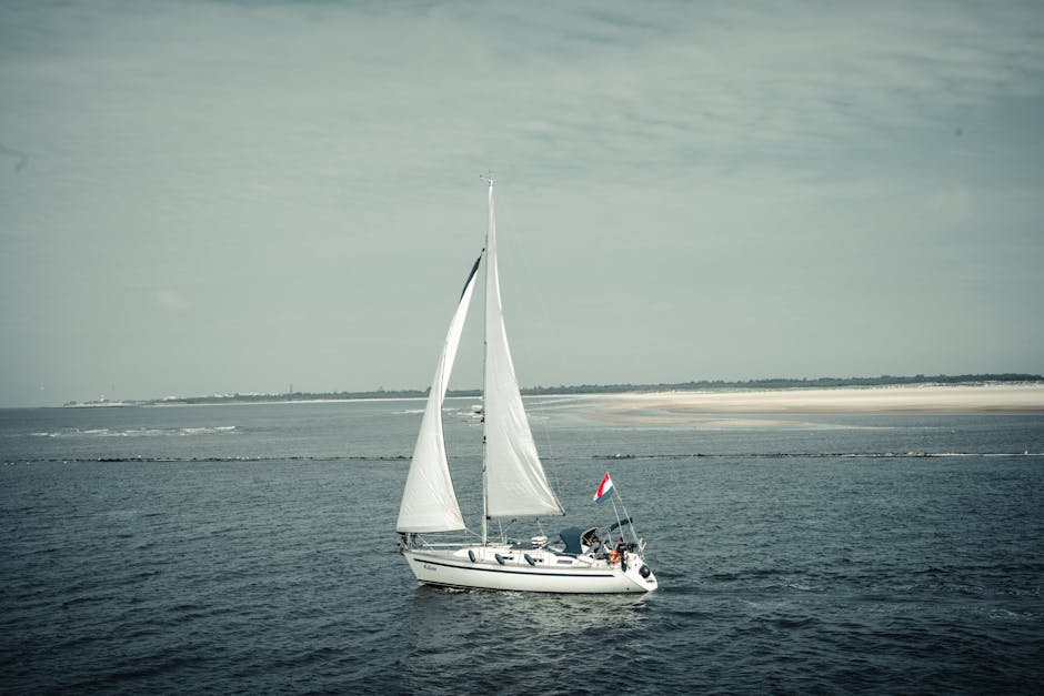 A sailboat is sailing on the ocean