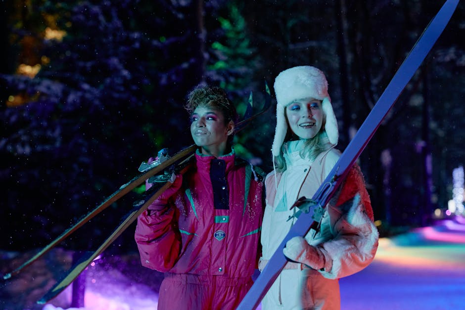 Woman in Winter Clothes Holding Their Skis