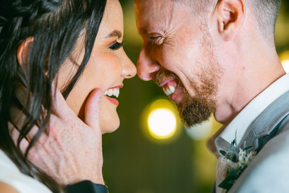 A bride and groom smile at each other