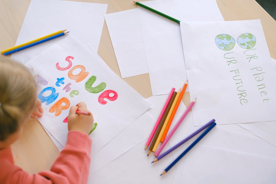 A Child Coloring a White Paper
