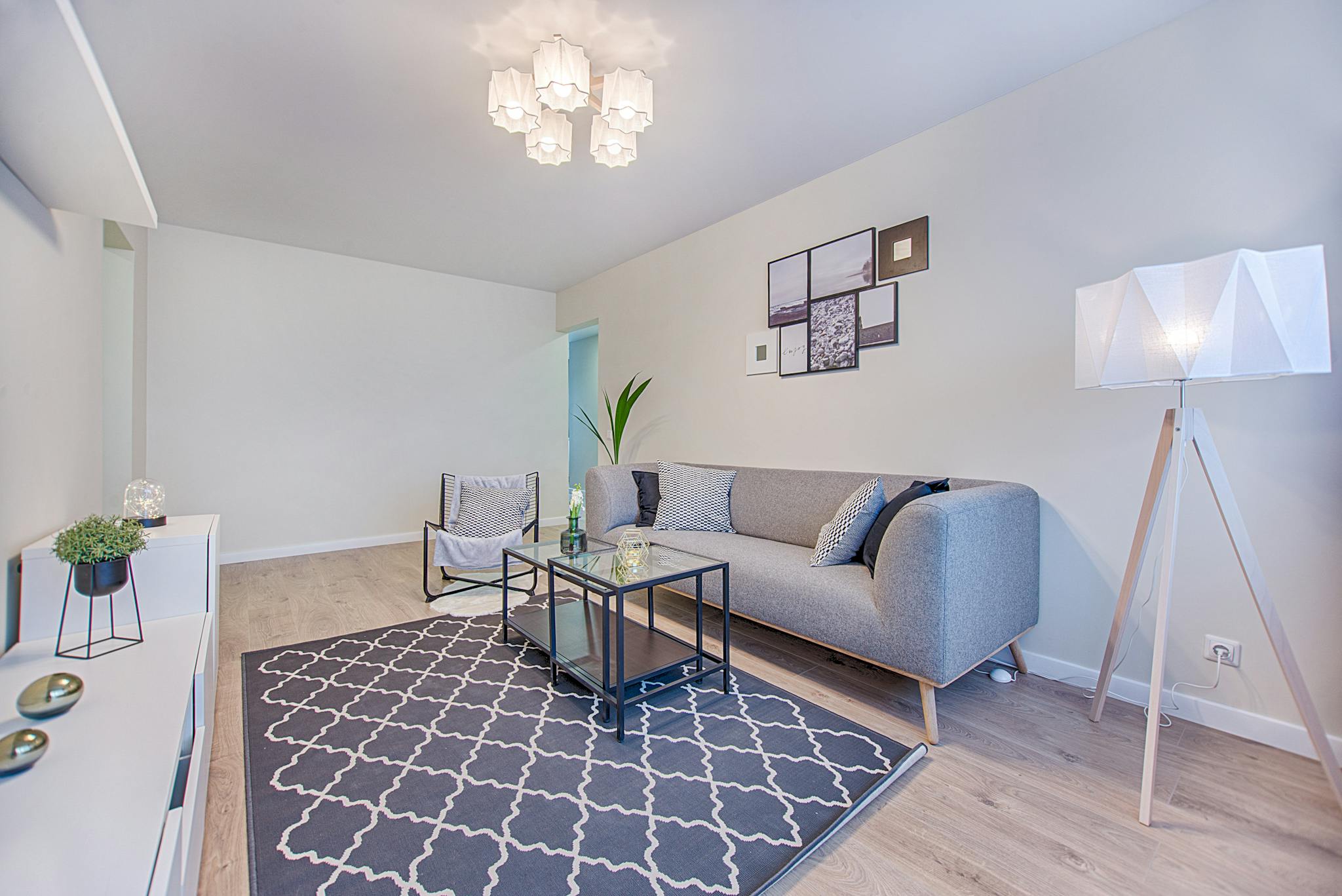 A living room with a kitchen and dining area