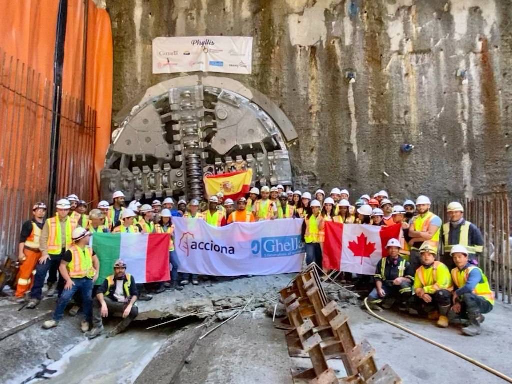 Boring machine drilling hole in wooden plank