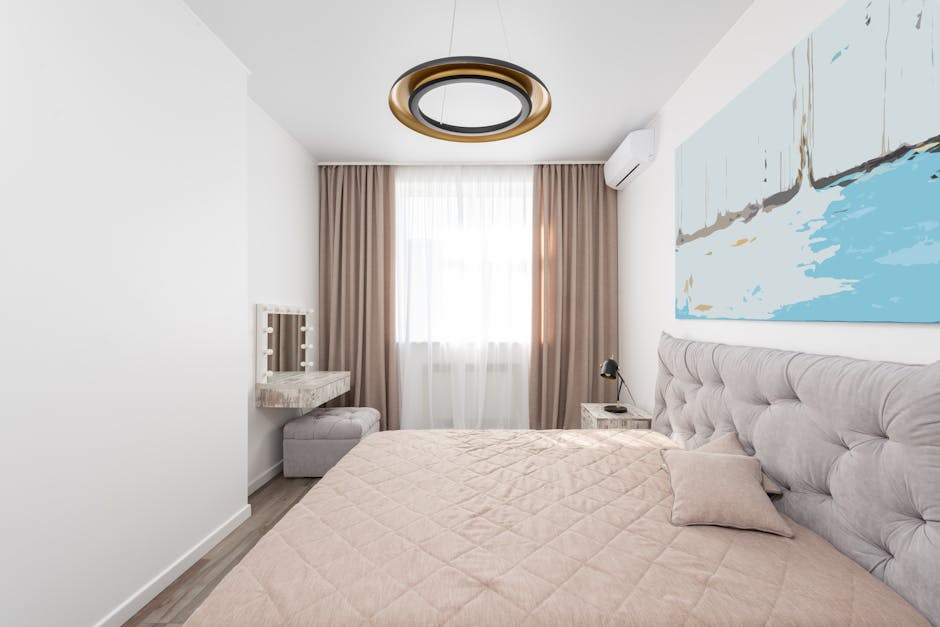 Perspective view of bedroom with bed covered with beige plaid in modern apartment