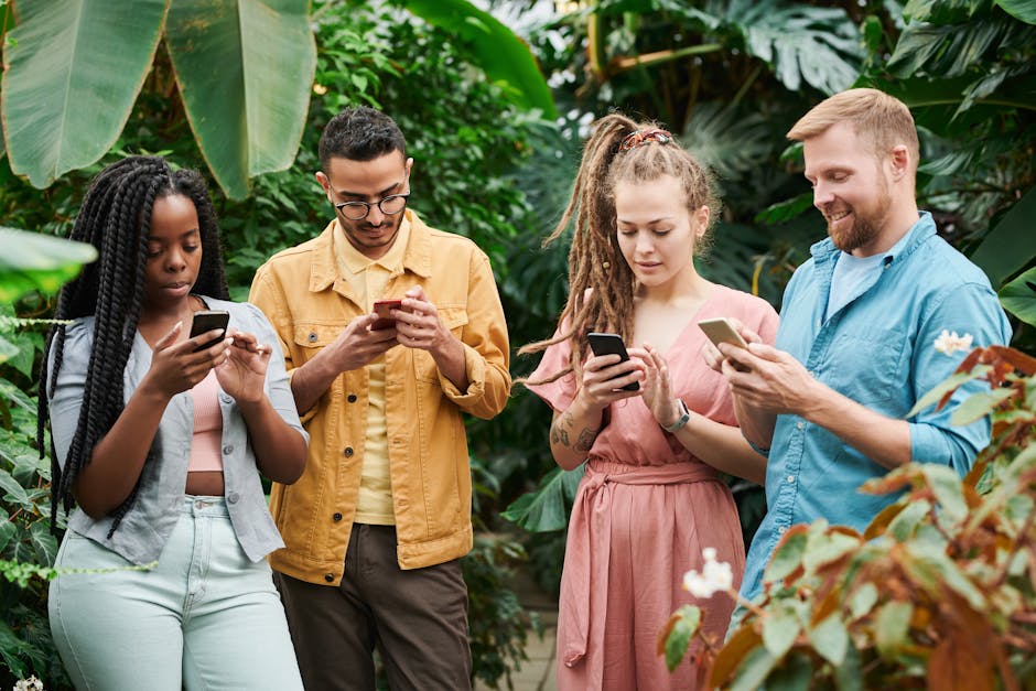 Photo Of People Holding Cellphones