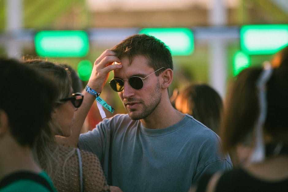 Man in Sunglasses in Crowd at Festival