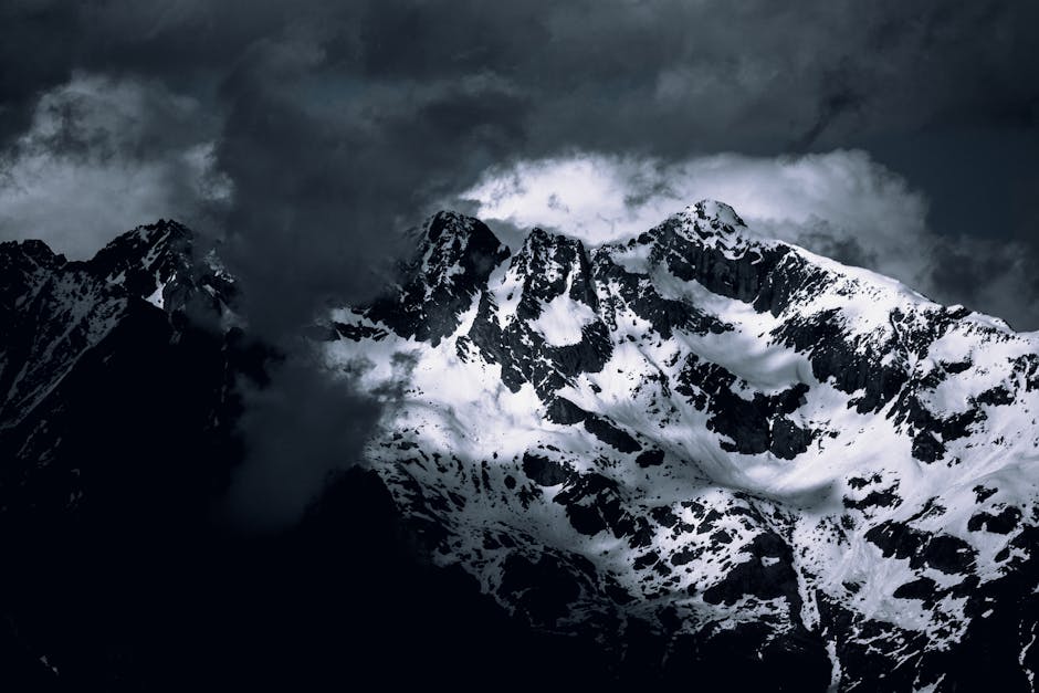 A dark and stormy sky over a mountain range