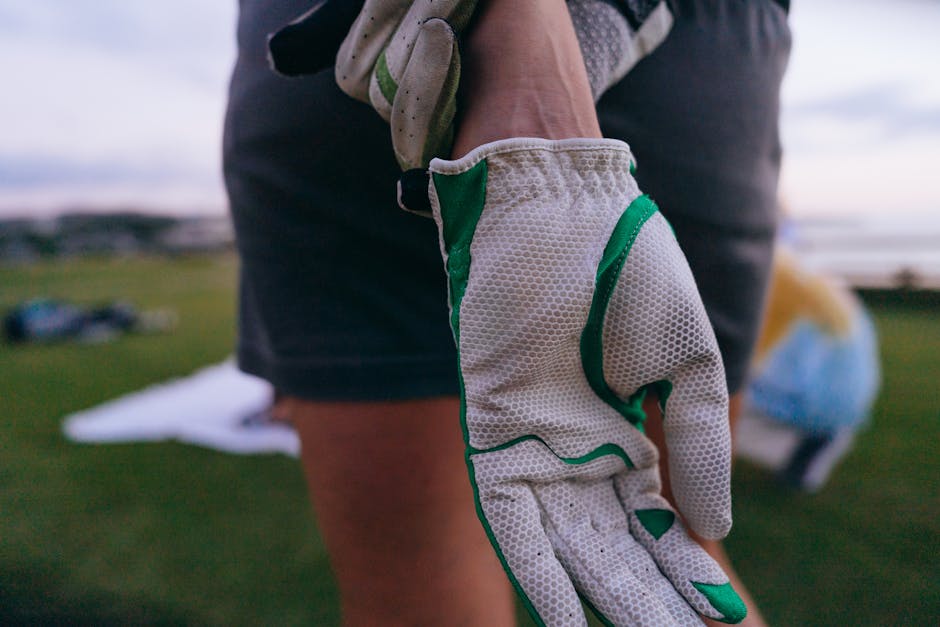 Hand in White and Green Glove