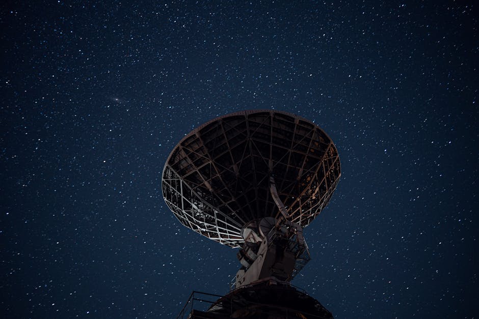 Radio telescope under bright starry sky