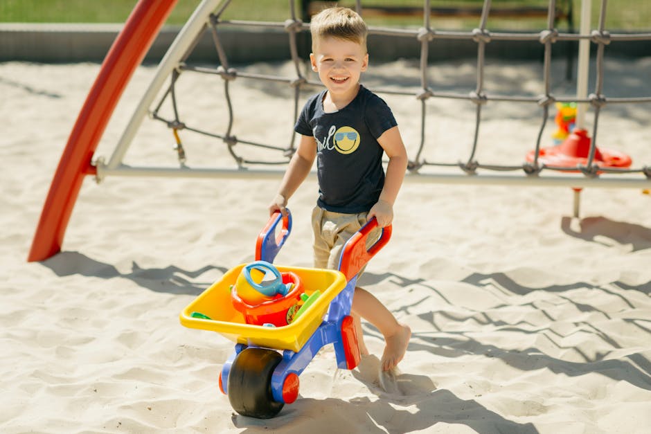 A Boy Playing in the Sand withy Toys