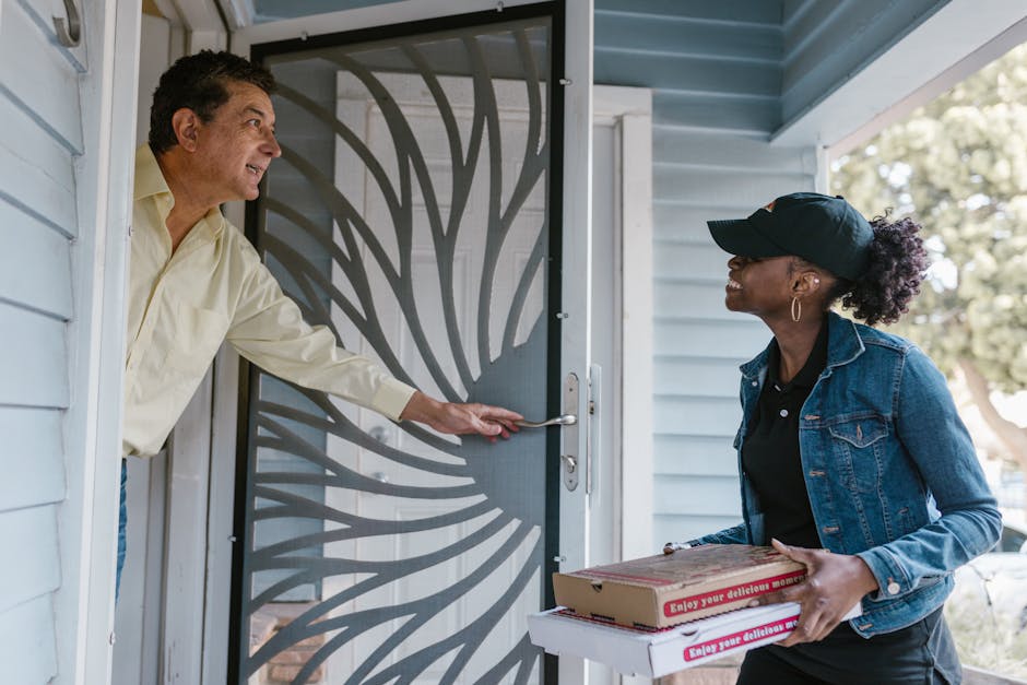 A Woman Delivering Boxes of Pizza