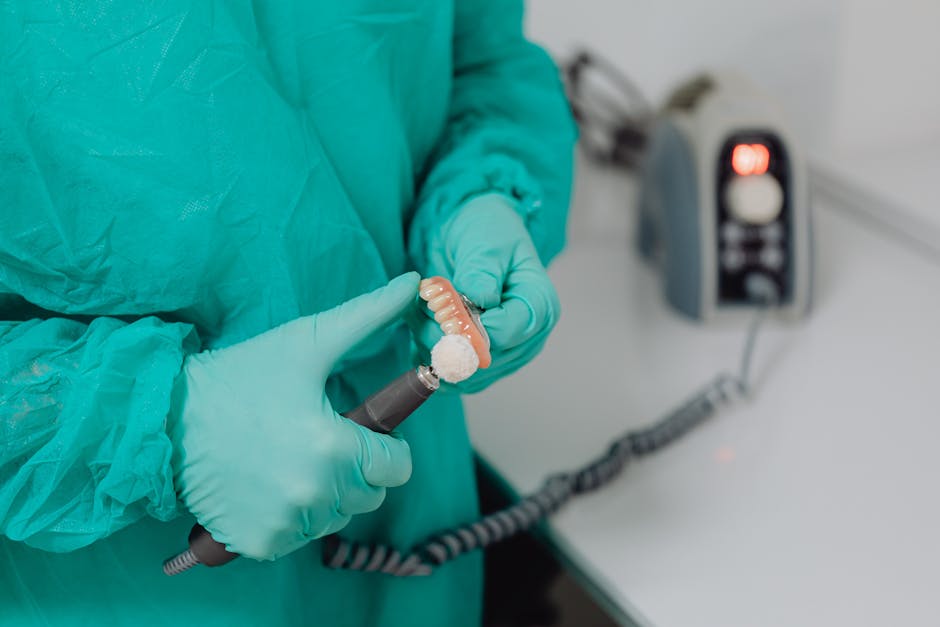 Close Up of Doctor Hands with Denture