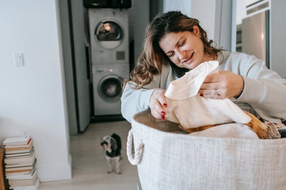 Positive woman with clean clothes speaking on smartphone