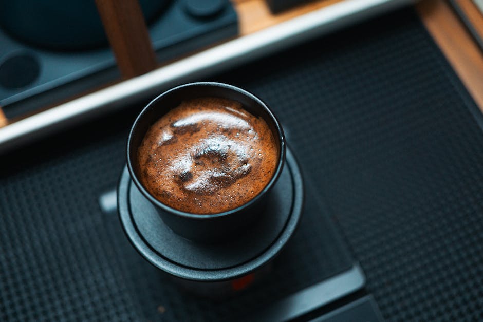 A cup of coffee sitting on top of a table