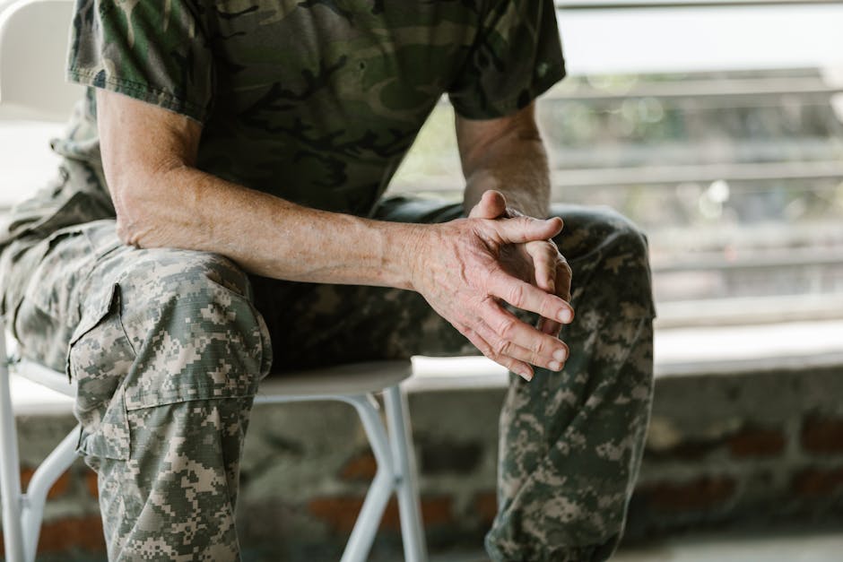 Man in Green and Brown Camouflage Shirt