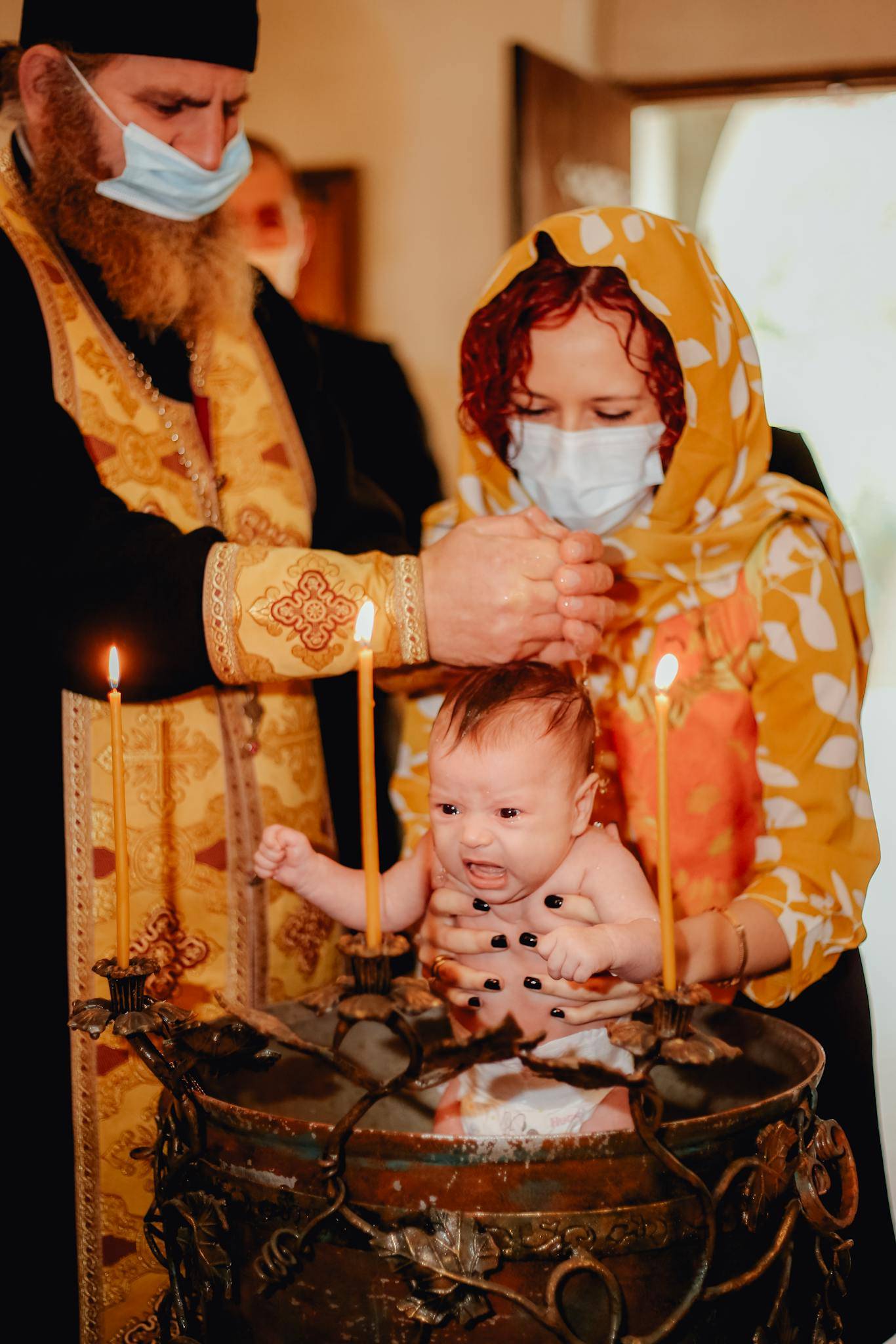 Priest Baptising Baby