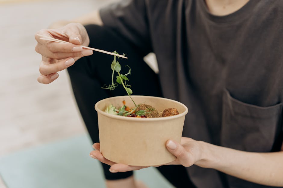 Person Holding A Bowl With Vegetables