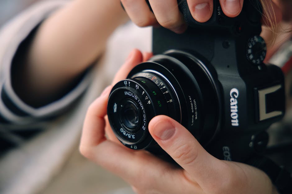 Photographer Adjusting Vintage Industar 50-2 Lens On Modern Canon Camera