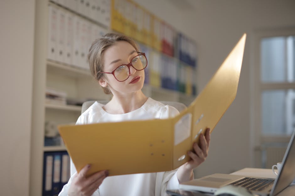 Female Accountant Looking at Documents