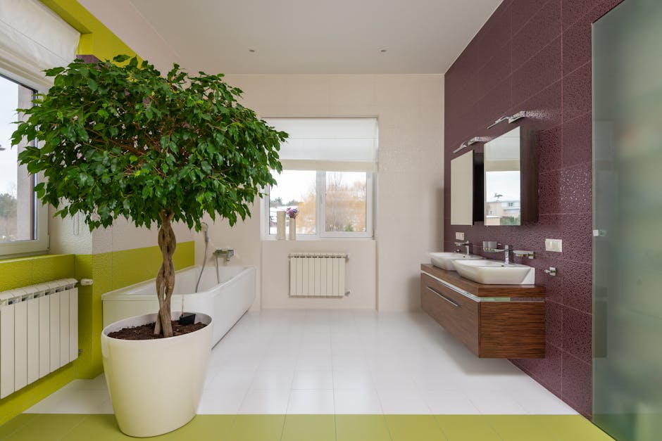 Interior of modern colorful master bathroom with shower cabin and tub in front of double sink cabinet with mirrors in daylight